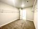 Spacious walk-in closet with hanging rods and access to another room at 333 Hopewell Branch Ct, Smithfield, NC 27577