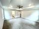 Large main bedroom with carpet, ceiling fan and ensuite bath at 333 Hopewell Branch Ct, Smithfield, NC 27577