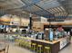 Various food vendors with seating in a modern food hall at 333 Hopewell Branch Ct, Smithfield, NC 27577
