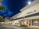 Upscale shopping center with Coach and other stores at night at 333 Hopewell Branch Ct, Smithfield, NC 27577