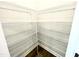 Large pantry with ample shelving for food storage at 333 Hopewell Branch Ct, Smithfield, NC 27577