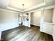 Bright dining room with hardwood floors and elegant light fixture at 333 Hopewell Branch Ct, Smithfield, NC 27577