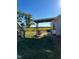 Relaxing covered patio overlooks a scenic farmland view at 283 Pump Station Rd, Erwin, NC 28339