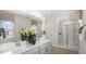 Spa-like bathroom with double sinks and a large shower at 385 Swift Creek Farm Ln, Clayton, NC 27520