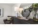 Stylish bedroom with leather chair and dark dresser at 385 Swift Creek Farm Ln, Clayton, NC 27520