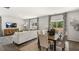 Bright dining area with hardwood floors and access to the kitchen at 385 Swift Creek Farm Ln, Clayton, NC 27520