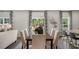 Bright dining room with hardwood floors and large windows at 385 Swift Creek Farm Ln, Clayton, NC 27520