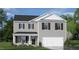 Two-story home with gray siding, white accents, and a two-car garage at 385 Swift Creek Farm Ln, Clayton, NC 27520