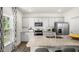 Modern kitchen with granite countertops, stainless steel appliances, and ample cabinet space at 385 Swift Creek Farm Ln, Clayton, NC 27520