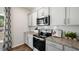 Modern kitchen with granite countertops and stainless steel appliances at 385 Swift Creek Farm Ln, Clayton, NC 27520