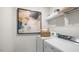 Laundry room with washer, dryer, and shelving at 385 Swift Creek Farm Ln, Clayton, NC 27520