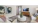 Comfortable living room featuring hardwood floors and large windows at 385 Swift Creek Farm Ln, Clayton, NC 27520