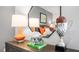 Nightstand with lamps, football helmet, and trophy at 385 Swift Creek Farm Ln, Clayton, NC 27520