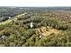 Aerial view showing home's location in wooded area at 488 Colvard Farms Rd, Durham, NC 27713