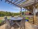 Stone patio with fire pit and seating area at 548 Double N Rd, Pittsboro, NC 27312