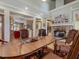 Bright dining room with wooden table and stone fireplace at 548 Double N Rd, Pittsboro, NC 27312