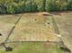 Aerial view of pasture and animal enclosures at 548 Double N Rd, Pittsboro, NC 27312