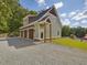 Three-car detached garage with charming exterior at 548 Double N Rd, Pittsboro, NC 27312