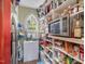 Walk-in pantry with ample shelving for storage at 548 Double N Rd, Pittsboro, NC 27312