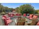 Fire pit area with red chairs and view of the property at 548 Double N Rd, Pittsboro, NC 27312