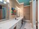 Double vanity bathroom with a teal ceiling and large mirrors at 548 Double N Rd, Pittsboro, NC 27312