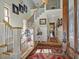 Bright two-story entryway with staircase and rug at 548 Double N Rd, Pittsboro, NC 27312