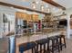 Large kitchen island with seating, granite countertops, and stainless steel appliances at 548 Double N Rd, Pittsboro, NC 27312