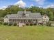 Exterior of charming house with large wrap-around porch and spacious backyard at 548 Double N Rd, Pittsboro, NC 27312