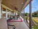 Spacious wrap-around porch with seating for outdoor dining at 548 Double N Rd, Pittsboro, NC 27312