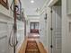 Long hallway with hardwood floors and wainscoting at 548 Double N Rd, Pittsboro, NC 27312