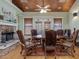 Formal dining room features a stone fireplace and a large wooden table at 548 Double N Rd, Pittsboro, NC 27312