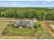 Aerial view of property showing house, separate building, and riding area at 548 Double N Rd, Pittsboro, NC 27312