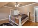 King-size bedroom with hardwood floors and a built-in dresser at 548 Double N Rd, Pittsboro, NC 27312