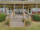 Steps leading up to a charming farmhouse porch at 548 Double N Rd, Pittsboro, NC 27312