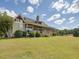 House exterior with large porch and lawn at 548 Double N Rd, Pittsboro, NC 27312