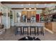 Open kitchen with island, granite countertops and wooden beams at 548 Double N Rd, Pittsboro, NC 27312
