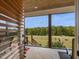 Relaxing porch overlooking a large pasture with horses at 548 Double N Rd, Pittsboro, NC 27312
