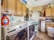 Laundry room features washer, dryer, and ample cabinetry at 548 Double N Rd, Pittsboro, NC 27312