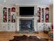 Fireplace with built-in shelving and mantel at 548 Double N Rd, Pittsboro, NC 27312