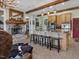 Kitchen features a stone fireplace and large island with seating at 548 Double N Rd, Pittsboro, NC 27312