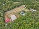 Aerial view of a property with house and riding arena at 548 Double N Rd, Pittsboro, NC 27312
