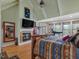 Main bedroom with large windows and a fireplace at 548 Double N Rd, Pittsboro, NC 27312