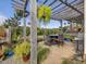 Stone patio with fire pit, pergola, and seating area, offering scenic views at 548 Double N Rd, Pittsboro, NC 27312