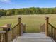 Wooden stairs leading down to expansive backyard at 548 Double N Rd, Pittsboro, NC 27312