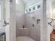 Large walk-in shower with tile surround and built-in seat at 548 Double N Rd, Pittsboro, NC 27312