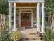 Front porch with stone and double wooden doors at 548 Double N Rd, Pittsboro, NC 27312