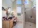 Bathroom boasts a vanity with a large mirror and a walk-in shower at 548 Double N Rd, Pittsboro, NC 27312