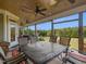 Relaxing screened porch with outdoor dining set and tranquil views at 548 Double N Rd, Pittsboro, NC 27312