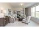 Cozy living room featuring neutral decor and ample natural light at 259 Johnson Ridge Way, Four Oaks, NC 27524