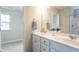 Double vanity bathroom with a view of bedroom at 259 Johnson Ridge Way, Four Oaks, NC 27524